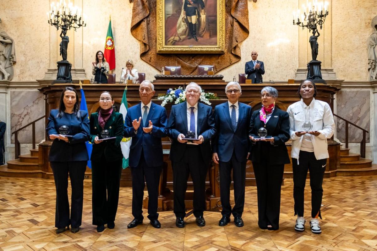 Seven people pose for a group photo
